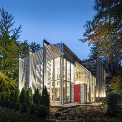 Modern Sunroom addition with exposed structural framing. Akar Architecture.