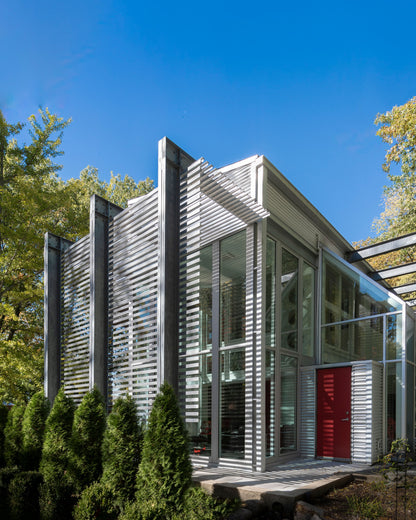 Modern Sunroom addition with exposed structural framing. Akar Architecture.